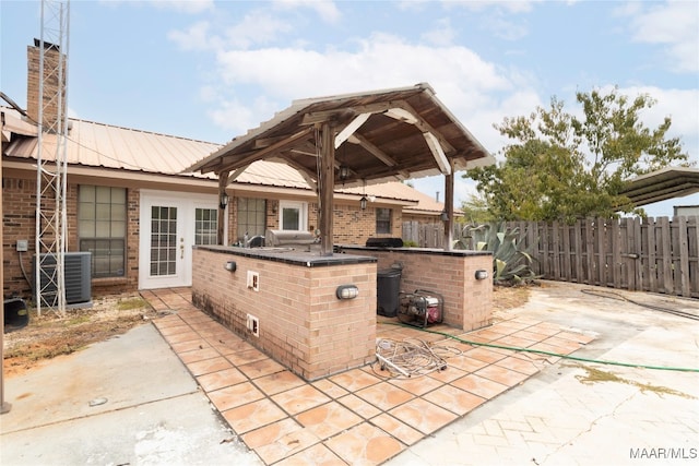 view of patio featuring a grill and central AC