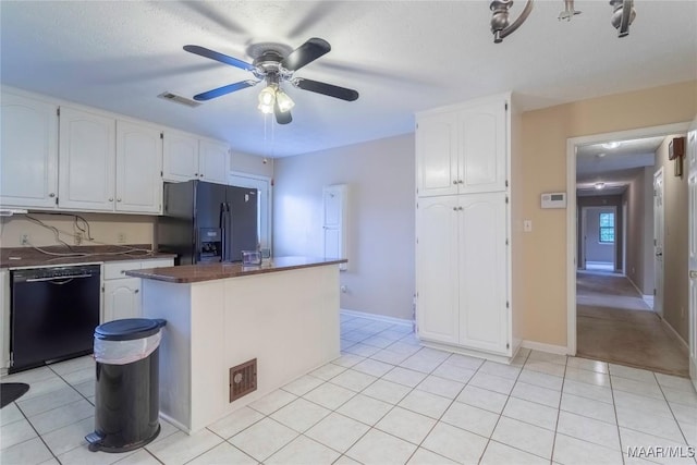 kitchen with white cabinetry, dark countertops, a ceiling fan, and black appliances