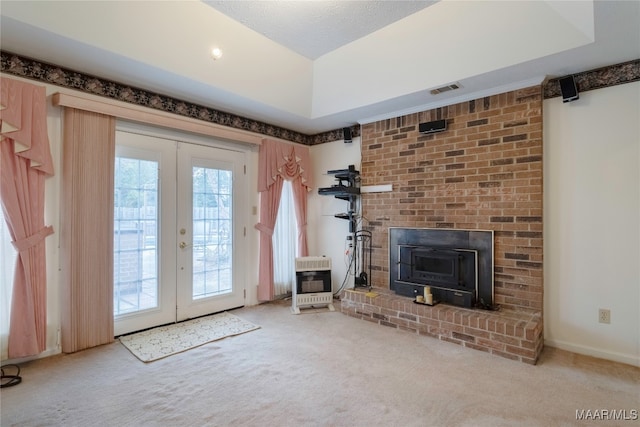 interior space with carpet, a fireplace, heating unit, and french doors