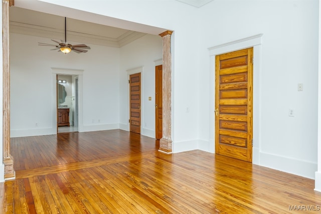 spare room with ceiling fan, hardwood / wood-style floors, and crown molding