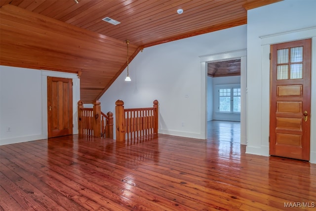 additional living space featuring vaulted ceiling, wood ceiling, and hardwood / wood-style floors