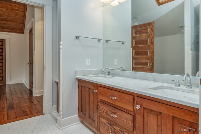 bathroom with hardwood / wood-style flooring and vanity