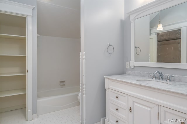 bathroom featuring vanity, toilet, and tile patterned floors