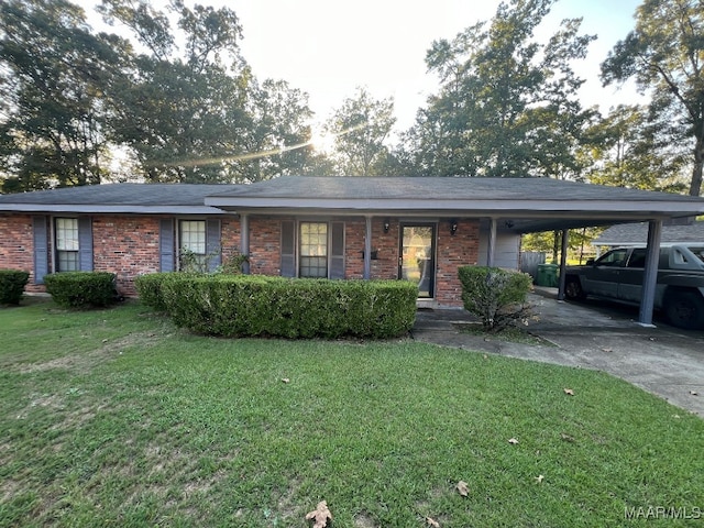 ranch-style house with a carport and a front lawn