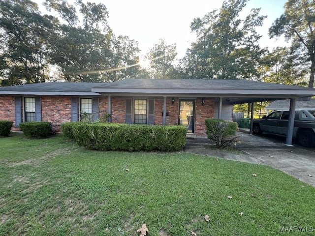 4512 Delray Rd, Montgomery, AL 36116 - single story home featuring an attached carport, concrete driveway, brick siding, and a front yard
