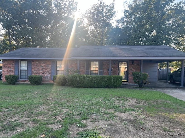 4512 Delray Rd, Montgomery, AL 36116 - single story home with concrete driveway, brick siding, a front yard, and an attached carport