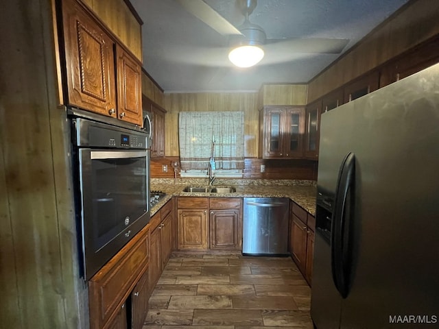 kitchen with ornamental molding, tasteful backsplash, stone countertops, appliances with stainless steel finishes, and dark hardwood / wood-style flooring