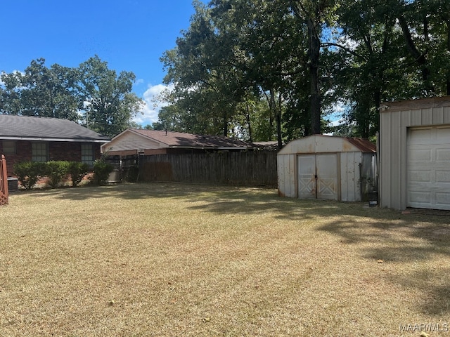 view of yard with a shed and a garage