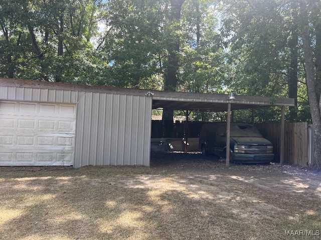 4512 Delray Rd, Montgomery, AL 36116 - view of vehicle parking featuring a detached garage and fence