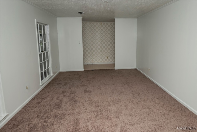 carpeted empty room featuring a textured ceiling