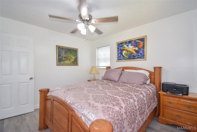 bedroom featuring light hardwood / wood-style floors and ceiling fan