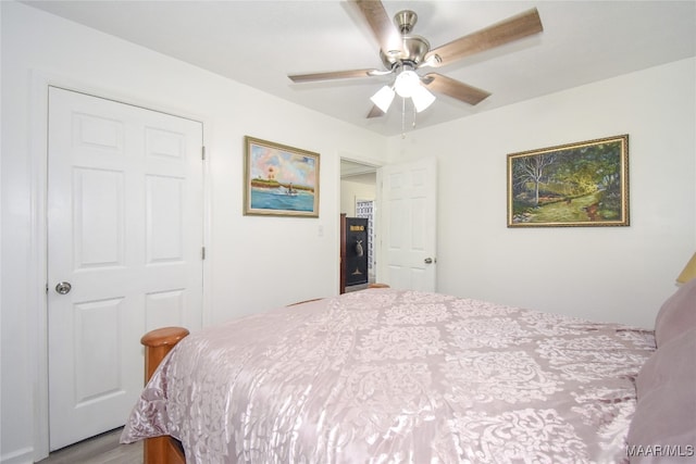 bedroom featuring light hardwood / wood-style flooring and ceiling fan