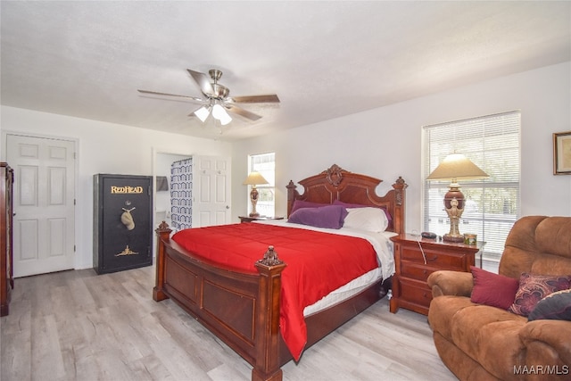 bedroom with light wood-type flooring and ceiling fan