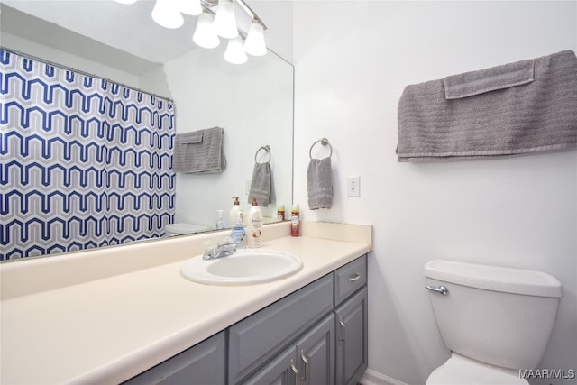 bathroom featuring vanity and toilet