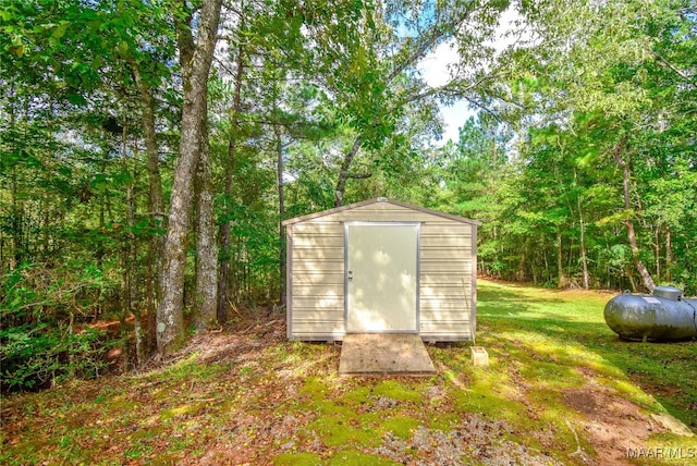 view of outbuilding with a lawn