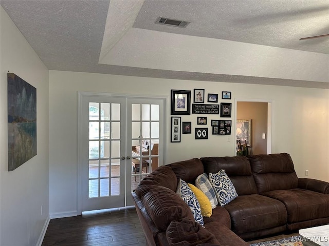 414 Warrior Dr, Valley Grande, AL 36701 - living room with french doors, a textured ceiling, dark wood finished floors, baseboards, and healthy amount of natural light