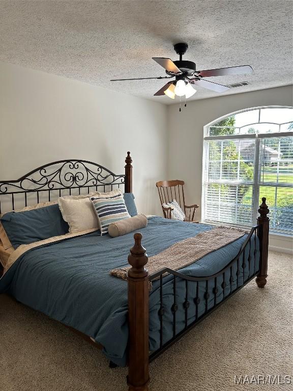 414 Warrior Dr, Valley Grande, AL 36701 - bedroom featuring carpet floors, a textured ceiling, and ceiling fan