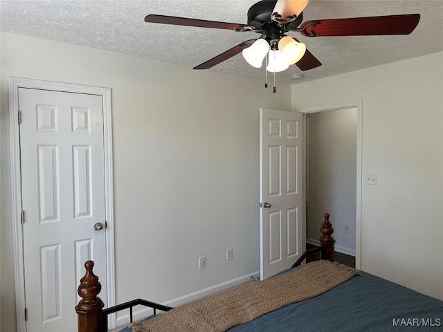 414 Warrior Dr, Valley Grande, AL 36701 - bedroom with a textured ceiling, ceiling fan, and baseboards