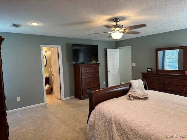 414 Warrior Dr, Valley Grande, AL 36701 - bedroom with baseboards, light carpet, a textured ceiling, ceiling fan, and ensuite bath