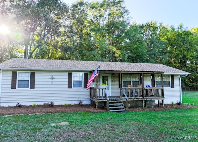 ranch-style house with crawl space, roof with shingles, a porch, and a front yard