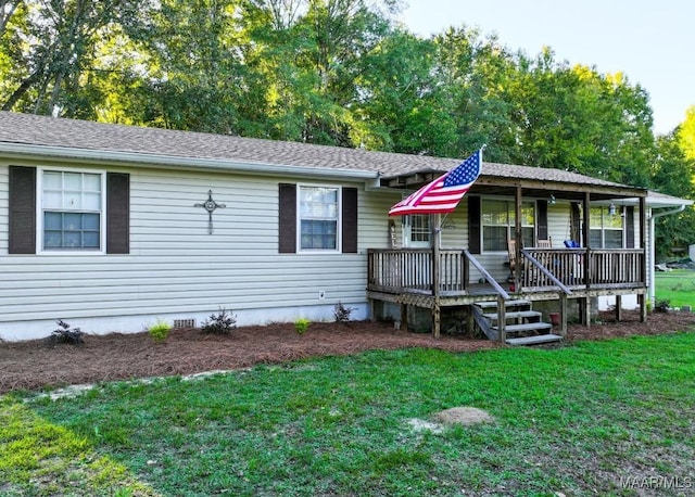 view of front of house with crawl space, roof with shingles, a front lawn, and a wooden deck