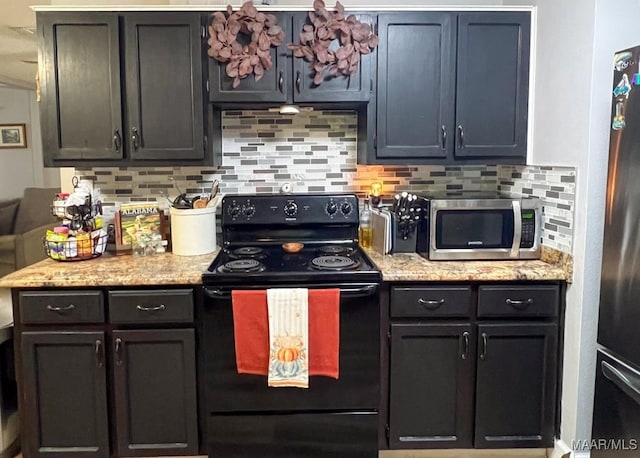 kitchen with black appliances, backsplash, and light stone countertops