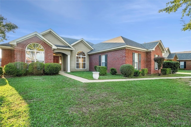 ranch-style house featuring a front yard