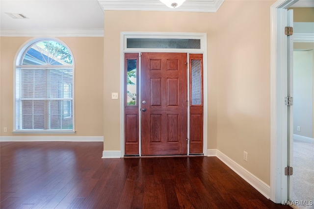 foyer featuring crown molding and dark wood-type flooring