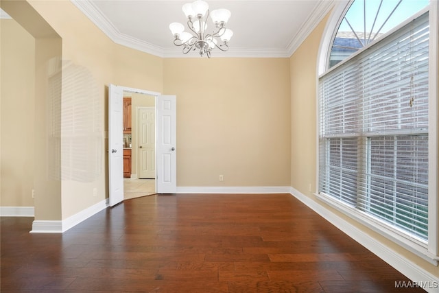 unfurnished room with a notable chandelier, dark hardwood / wood-style floors, and crown molding