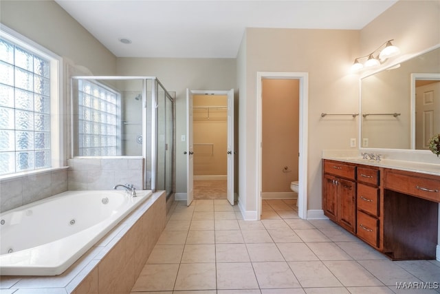 full bathroom featuring shower with separate bathtub, tile patterned flooring, vanity, and toilet