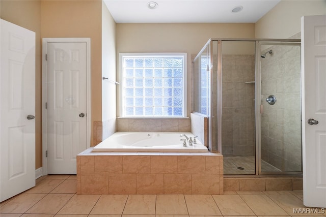 bathroom featuring shower with separate bathtub and tile patterned flooring