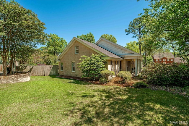 view of property exterior with a lawn