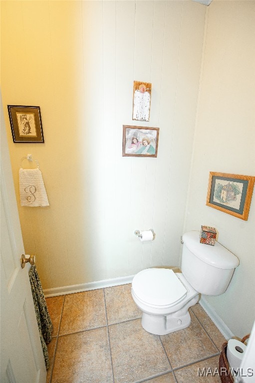 bathroom featuring tile patterned flooring and toilet