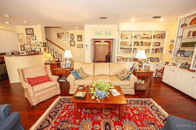 living room featuring crown molding and dark hardwood / wood-style floors