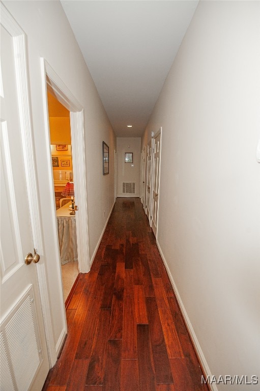 corridor featuring dark wood-type flooring