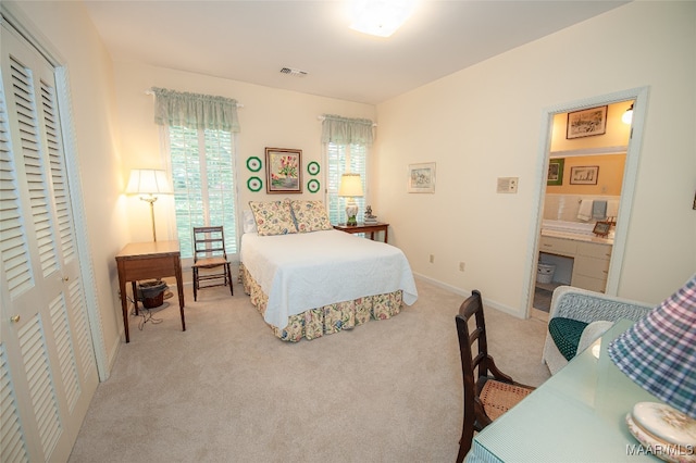 carpeted bedroom with a closet