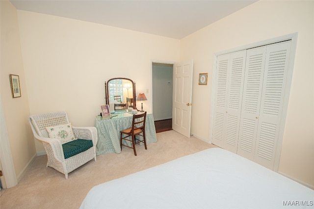 carpeted bedroom featuring a closet