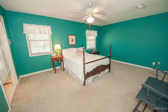 carpeted bedroom with ceiling fan