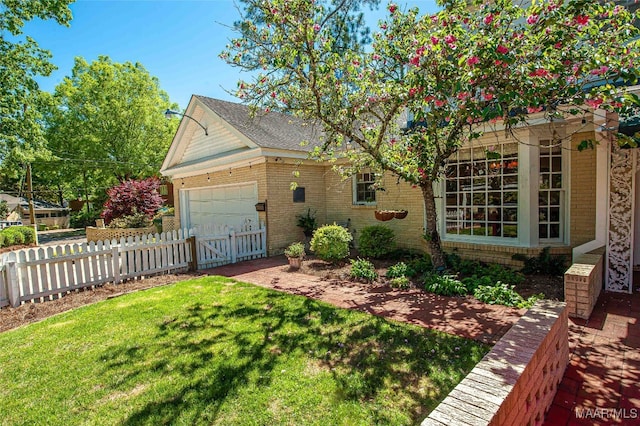 exterior space with a lawn and a garage