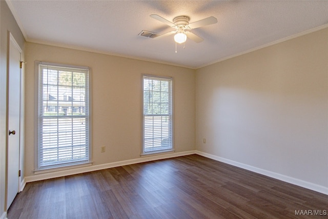 unfurnished room with crown molding, ceiling fan, plenty of natural light, and dark wood-type flooring