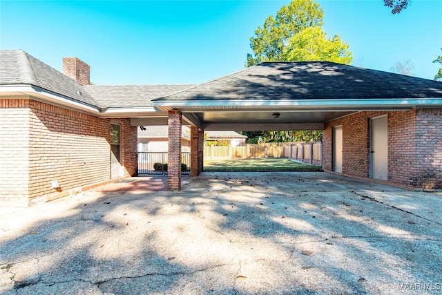 exterior space with a carport