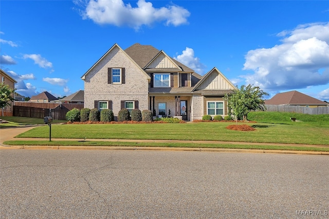 craftsman house with a front lawn