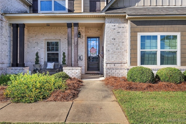 property entrance featuring covered porch