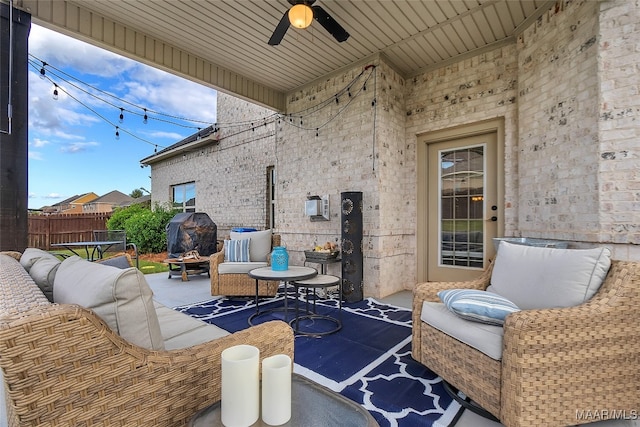 view of patio with outdoor lounge area and ceiling fan