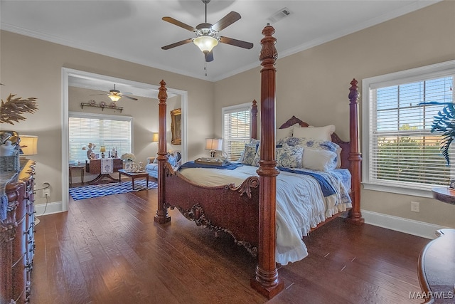 bedroom featuring ceiling fan, ornamental molding, and dark hardwood / wood-style flooring