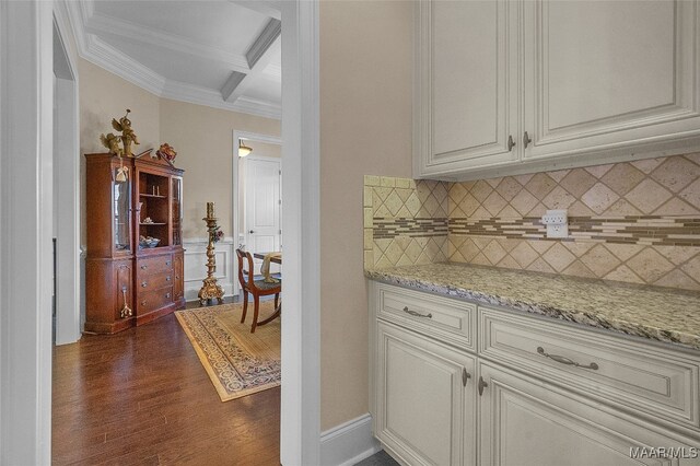 kitchen featuring coffered ceiling, white cabinets, dark hardwood / wood-style floors, and tasteful backsplash