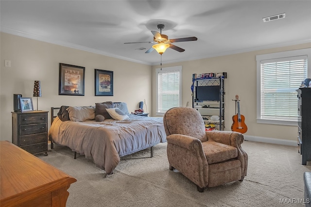 bedroom with ceiling fan, carpet flooring, and ornamental molding