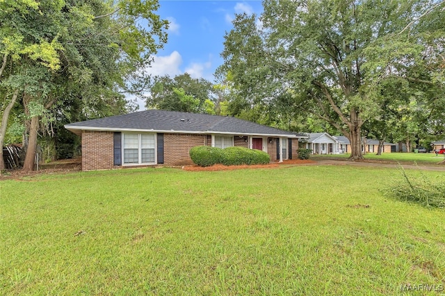 ranch-style house with a front lawn