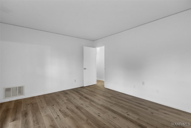 unfurnished room featuring wood-type flooring