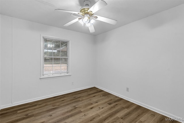 unfurnished room featuring ceiling fan and dark hardwood / wood-style floors